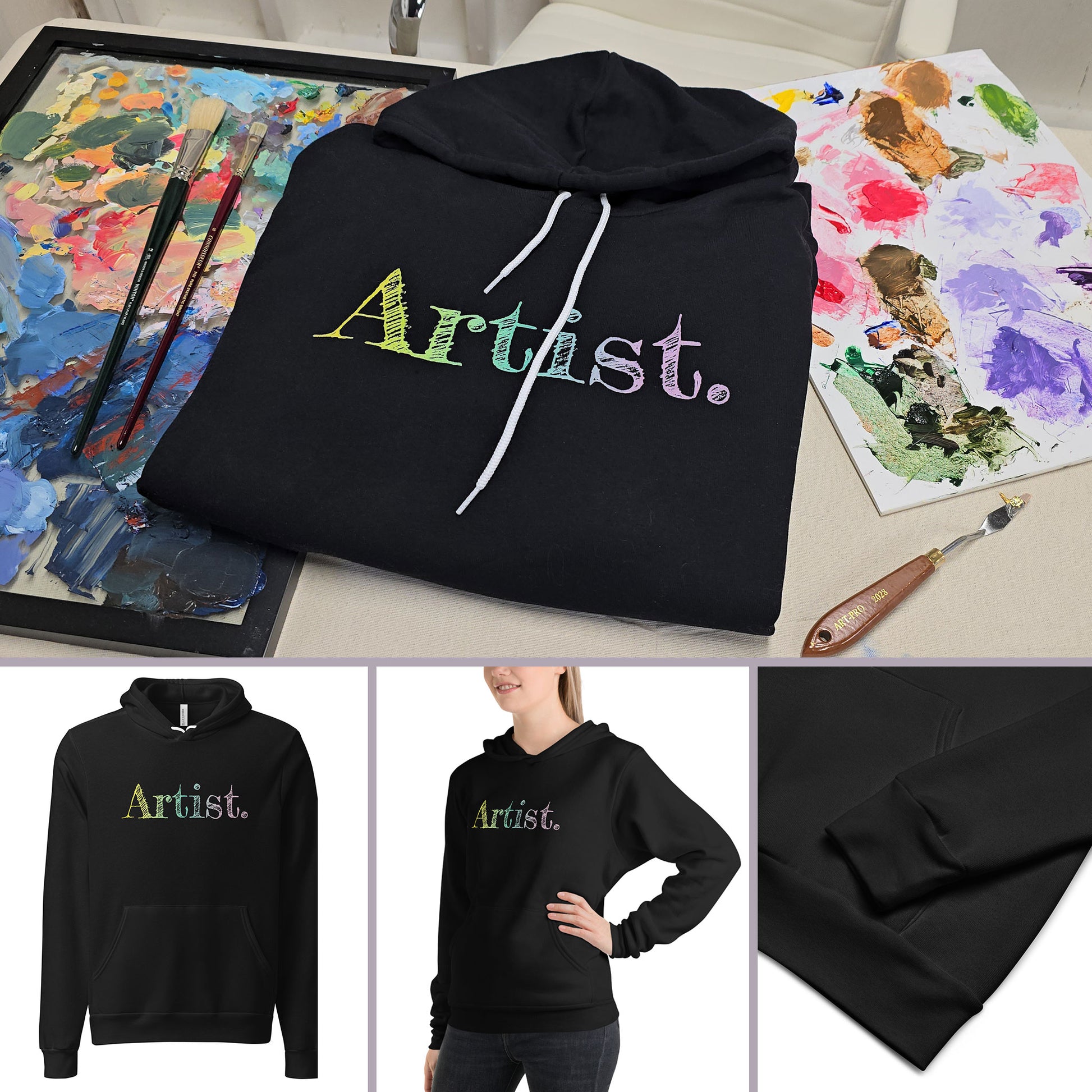 Close-up of the hoodie details on an artiist's background. A black artist hoodie is displayed in a flat lay. The hoodie features a sketch-style hand-drawn gradient text design in yellow, green and light purple, ideal for artists, creatives, students and illustrators. This aesthetic art hoodie is perfect for year-round outfits and makes a thoughtful gift for art lovers.