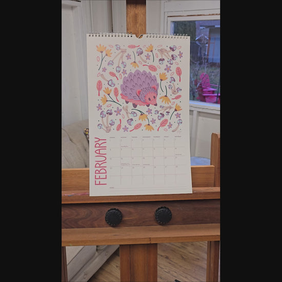Video of a 2026 wall calendar featuring colourful folk-art animal illustrations. Wire-bound with premium thick paper, this illustrated monthly calendar showcases vibrant artwork for each month. Ideal for shoppers looking for a 2026 calendar, animal art calendar, home décor calendar, or unique artist-designed wall calendar.