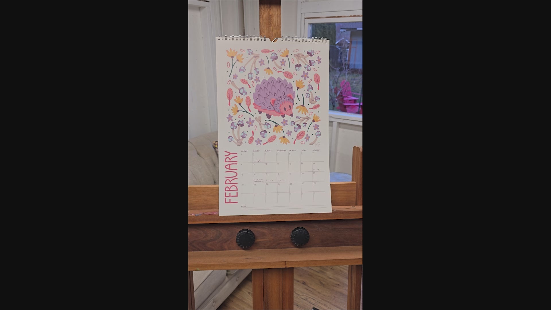 Video of a 2026 wall calendar featuring colourful folk-art animal illustrations. Wire-bound with premium thick paper, this illustrated monthly calendar showcases vibrant artwork for each month. Ideal for shoppers looking for a 2026 calendar, animal art calendar, home décor calendar, or unique artist-designed wall calendar.