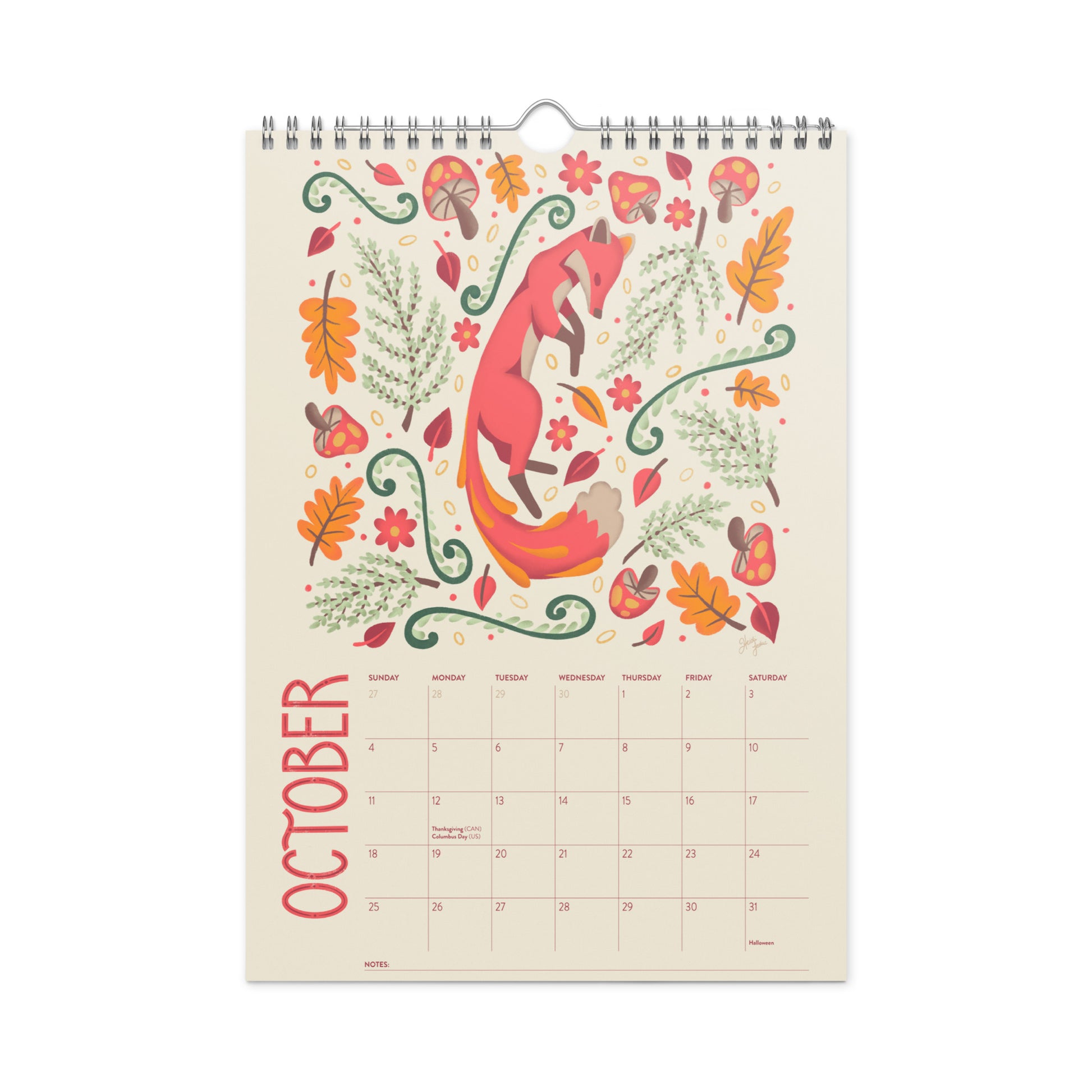 2026 wire-bound wall calendar hanging on a neutral wall, displaying colourful folk-art animal artwork and a clear monthly layout. Ideal for home offices, kitchens, studios, classrooms, or anyone looking for a decorative illustrated 2026 wall calendar with unique art